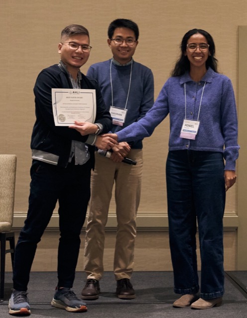 An award recipient receiving a certificate on stage